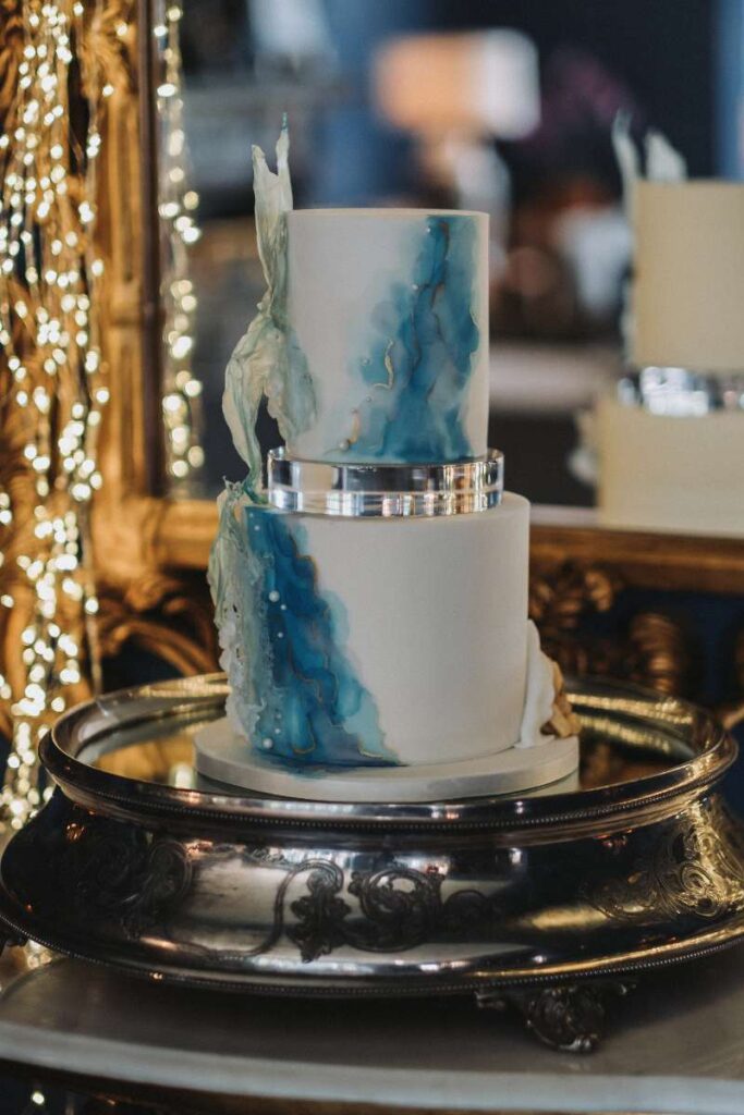 two tier blue and white water inspired wedding cake, Ellingham hall, Northumberland