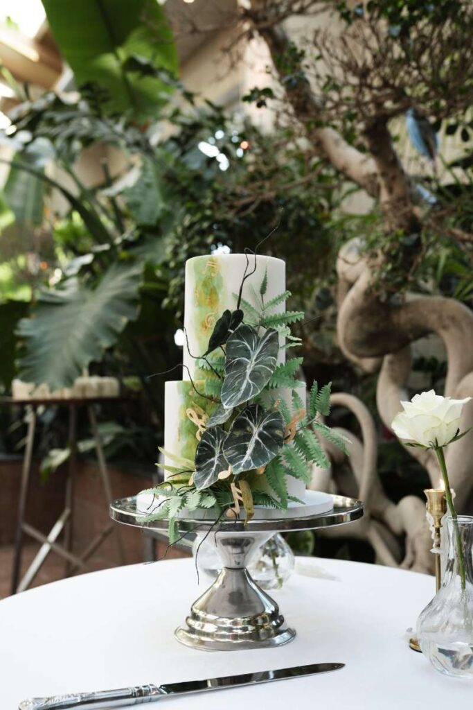 Two Tier , hand painted, botanical theme wedding cake, The Garden Room at Biscuit Factory Newcastle. Newcastle wedding cake